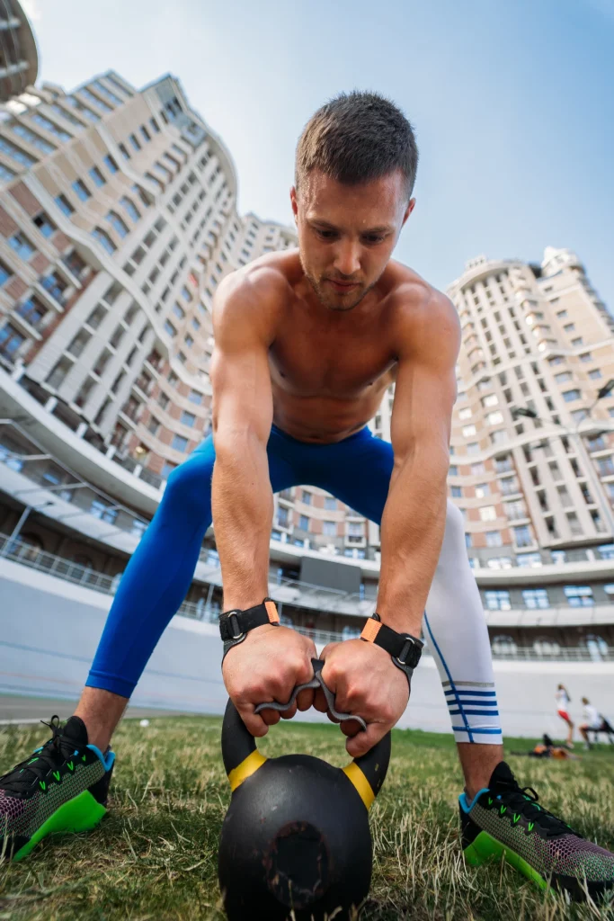 sportive-guy-training-with-kettlebell